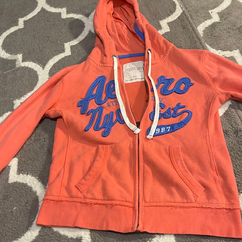 Peach, and blue jacket zip.
